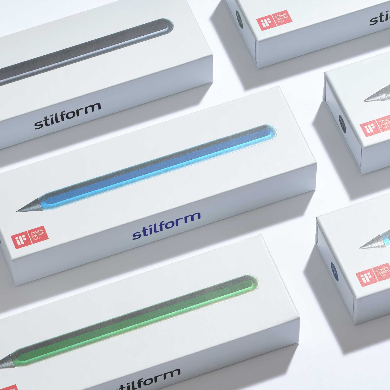 Verpackungen des AEON Pure Aluminium-Bleistifts mit stilform-Logo und farbiger Produktabbildung auf weißer Schachtel