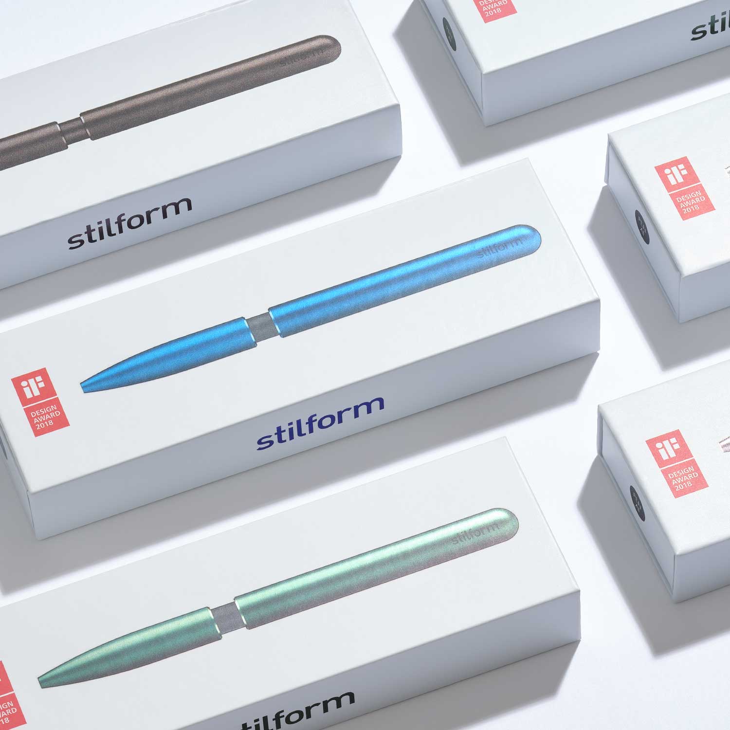 Verpackungen des AEON Aluminium-Kugelschreiber Pens mit stilform-Logo und farbiger Produktabbildung auf weißer Schachtel